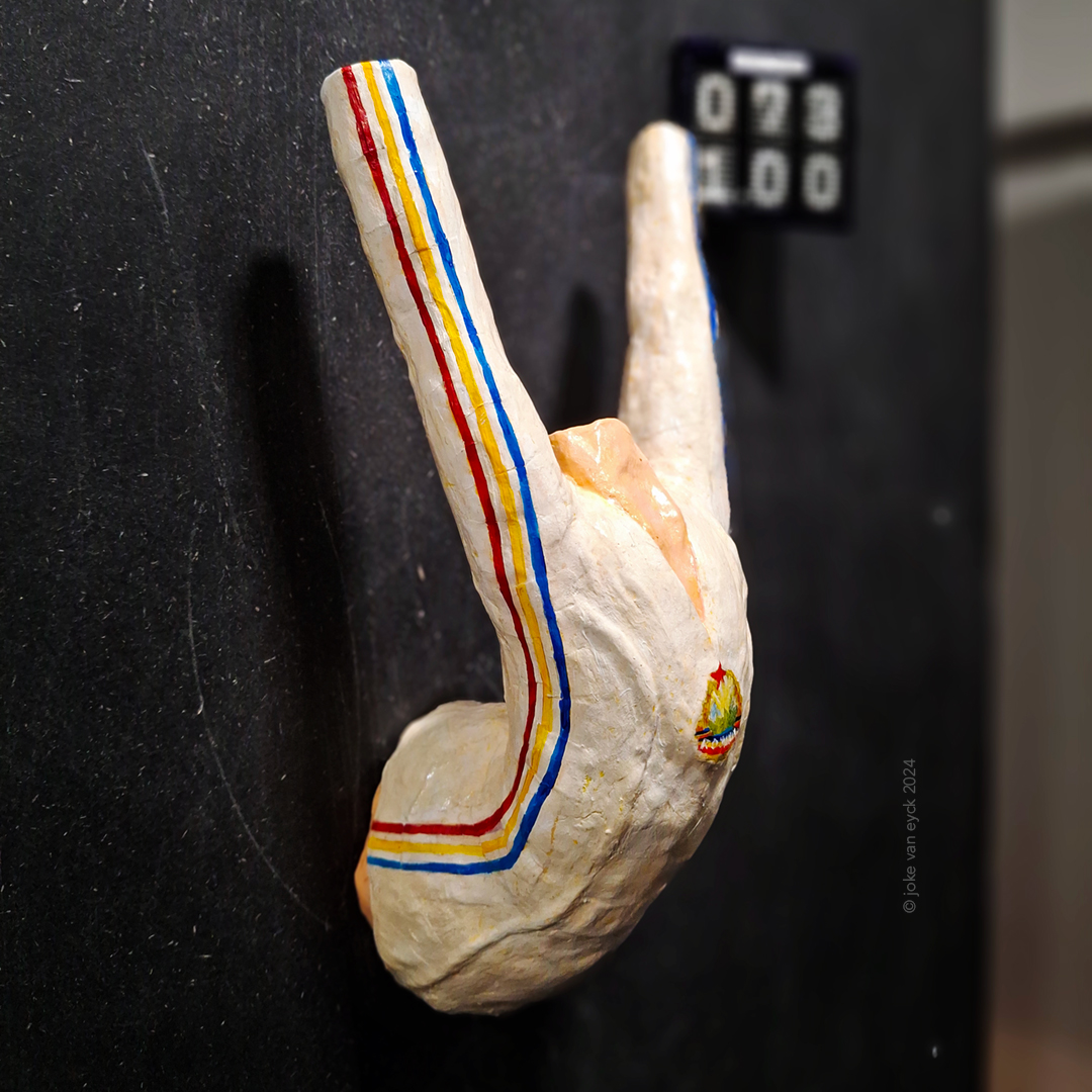 Painted Sculpture. Torso of Nadia Comāneci holding her arms in the air. Recycled paper pulp, painted. Artwork by ©joke van eyck 2024